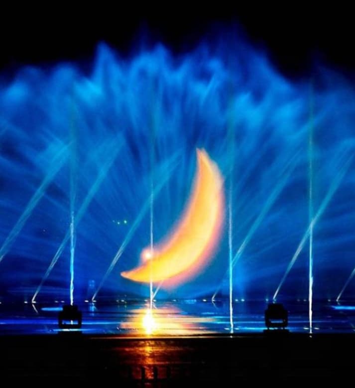 Laser Show01-Lasers split the night, streams weave star rivers.